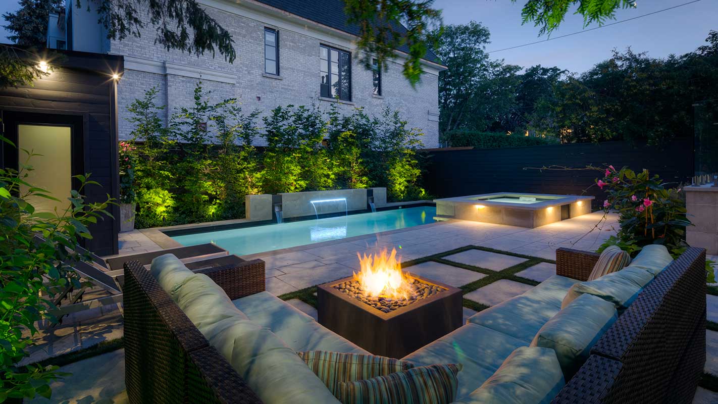 pool next to outdoor seating and fire pit