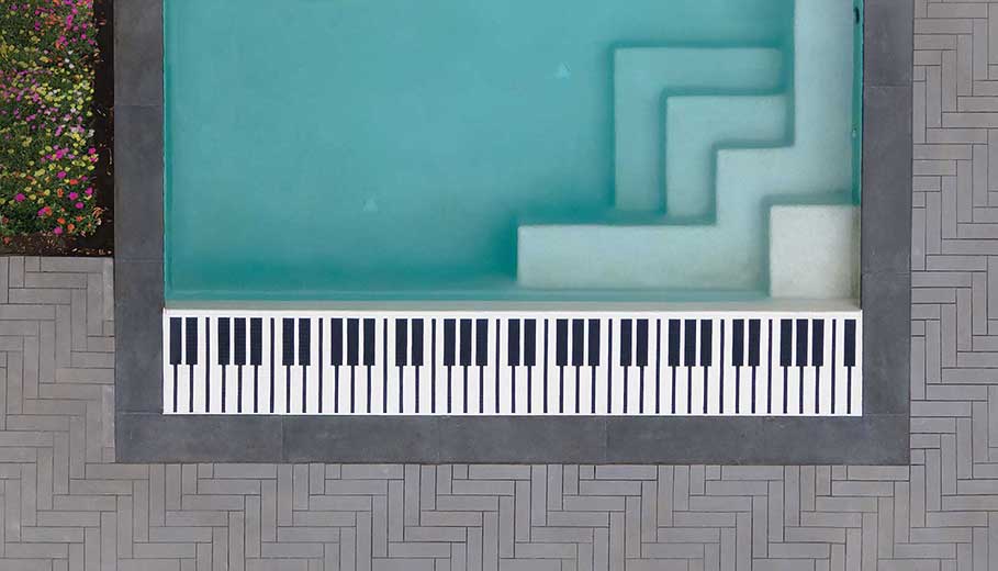 piano feature next to pool