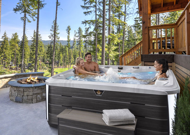 group sitting in hot tub