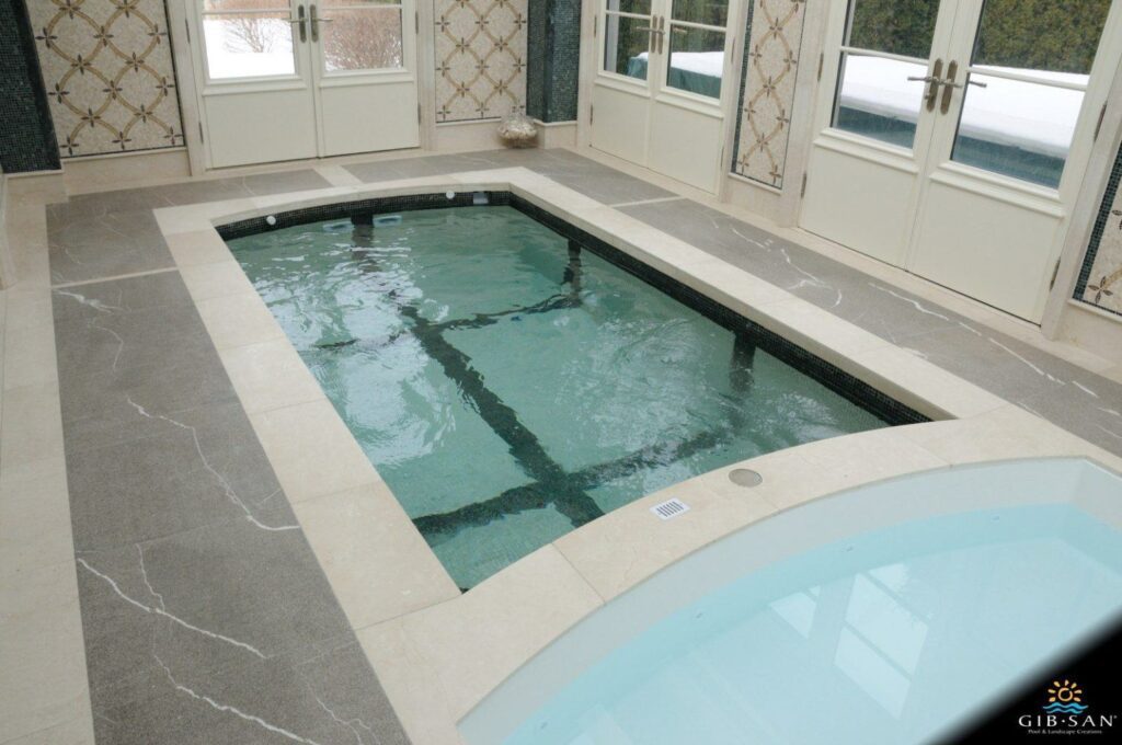 A small swim spa is pictured indoors.